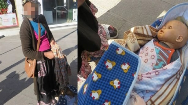Oyuncak bebekle dilenirken yakalandı