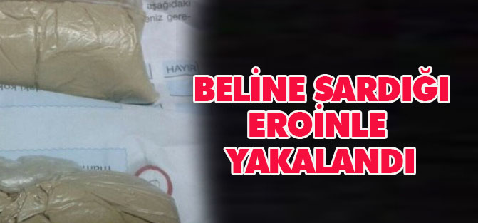 Beline sardığı eroinle yakalandı