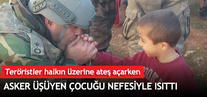 Asker üşüyen çocuğu nefesiyle ısıttı