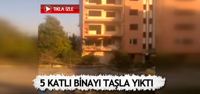 Attığı taşla 5 katlı binayı yıktı