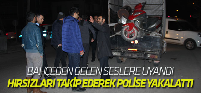 Bahçeden gelen seslere uyandı, hırsızları takip ederek polise yakalattı