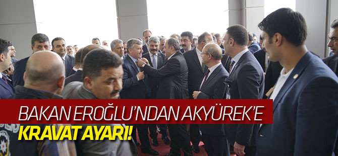 Bakan Eroğlu'ndan Akyürek'e kravat ayarı