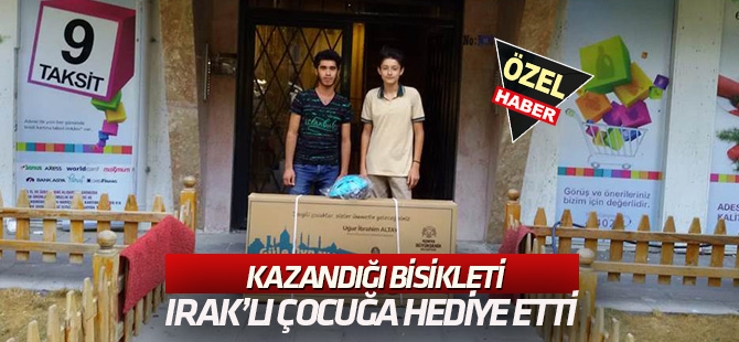 Kazandığı bisikleti Iraklı çocuğa hediye etti