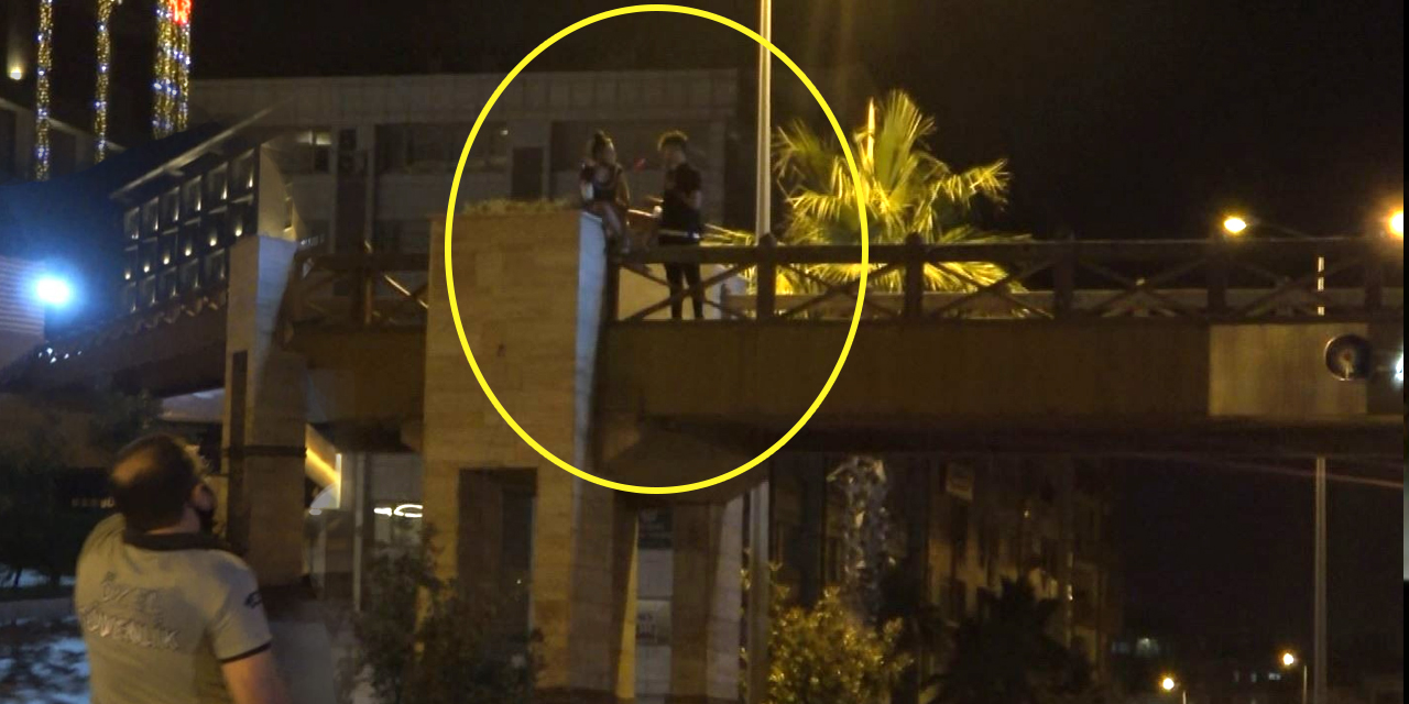 Antalya'da üst geçide çıkıp kolona oturan genç kız ekipleri alarma geçirdi