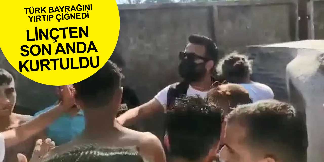 Türk Bayrağı'nı yırtıp çiğneyen kadın linçten son anda kurtuldu