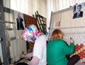 Liderlerin portreleri kilime dokunuyor