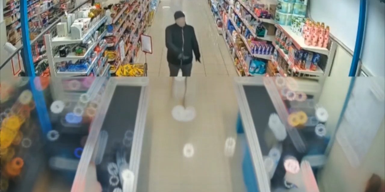 Yüzüne kadın çorabı geçirdi, marketin kasasını böyle boşalttı