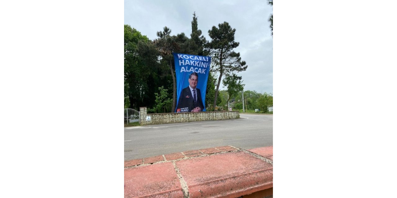 CHP milletvekili adayının seçim afişi mezarlığa asıldı