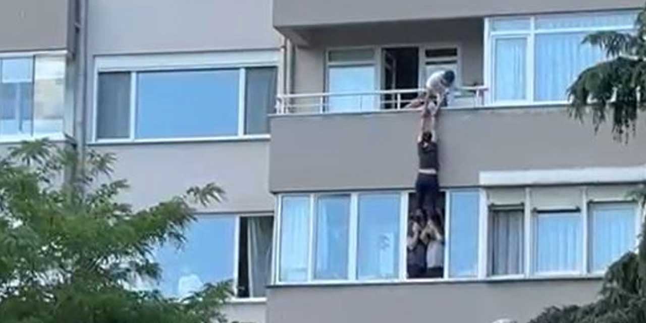 Atlamak için balkondan sarkan kadını, alt kattaki komşuları kurtardı