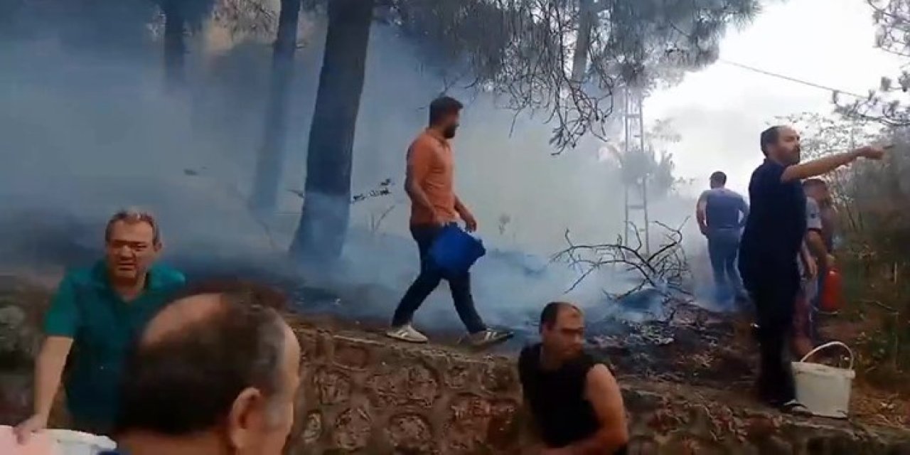 Yangın paniği: Kovasını kapan ormana koştu