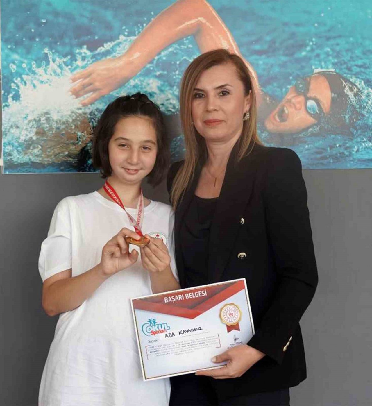 Şampiyon özel sporculara başarı belgesi